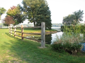 Community Fence by Stream